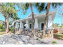 House with a welcoming front porch and lush landscaping at 1039 10Th N St, St Petersburg, FL 33705