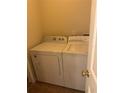 Laundry room with washer, dryer, and shelving at 1348 Impatiens Ct, Trinity, FL 34655