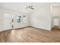 Bright and airy living room with hardwood floors and high ceilings at 15958 Adobe Dr, Hudson, FL 34667