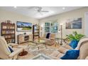 Bright living room with ample seating and a large TV at 2930 49Th S Ter, St Petersburg, FL 33712