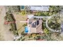 Bird's eye view of a home with a pool, dock, and waterfront access at 314 Shore E Dr, Oldsmar, FL 34677