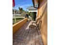 Brick patio with two chairs, offering a relaxing outdoor space at 4498 Lake Blvd, Clearwater, FL 33762