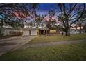 Brick home with a two-car garage at sunset at 4646 W Longfellow Ave, Tampa, FL 33629