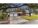 Ranch style brick home with a two car garage at 4646 W Longfellow Ave, Tampa, FL 33629