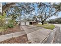 Two-car garage and a large front yard at 4646 W Longfellow Ave, Tampa, FL 33629