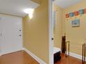 Bright entryway with coat closet and hardwood floors at 800 S Gulfview Blvd # 101, Clearwater Beach, FL 33767