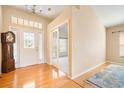 Bright entryway with hardwood floors, a coat closet, and French doors at 9551 Jaybird Ln, Land O Lakes, FL 34638