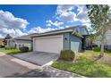 Spacious two-car garage with a clean concrete driveway at 11308 Great Neck Rd, Riverview, FL 33578