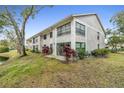 Rear view of condo building near water at 2188 Elm St # 1107, Dunedin, FL 34698