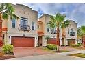 Three-story townhouses featuring a Spanish-style architectural design at 3222 W Empedrado St, Tampa, FL 33629