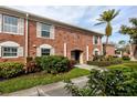 Brick condo building exterior with lush landscaping and walkway at 3475 41St S Ter # 215, St Petersburg, FL 33711