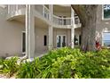 Private patio with lush landscaping and access to the backyard at 3507 Bayshore Blvd # 102, Tampa, FL 33629