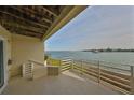 Waterfront patio with view of bay and passing boats at 4625 Mirabella Ct, St Pete Beach, FL 33706