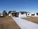 Front view of a manufactured home with covered porch at 5341 Mary St, Zephyrhills, FL 33542