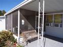 Screened porch with a bench, offering a relaxing outdoor space at 5341 Mary St, Zephyrhills, FL 33542