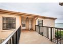 Condo entry with walkway leading to front door and bay view at 6051 Sun Blvd # 207, St Petersburg, FL 33715