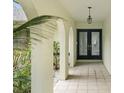 Elegant entryway with arched doorways and tiled flooring at 10186 Sleepy Willow Ct, Spring Hill, FL 34608