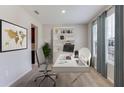 Bright home office features a desk, chairs, and built-in shelving at 10826 Patoka Ter, Parrish, FL 34219