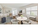 Open living space with comfortable seating and a dining area at 12011 Lansing Gln, Parrish, FL 34219