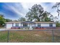 Recently updated home with neutral color palette and well-manicured lawn at 1801 E 99Th Ave, Tampa, FL 33612