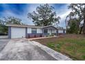 Charming single-story home with updated exterior and driveway at 1801 E 99Th Ave, Tampa, FL 33612