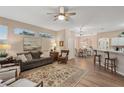 Spacious living room with hardwood floors, neutral decor, and access to a patio at 2028 Acadia Greens Dr, Sun City Center, FL 33573