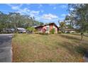 Brick home with a carport and lush green lawn at 2320 Shelly Dr # B, Palm Harbor, FL 34684