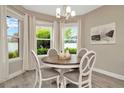 Bright breakfast nook with a round table and four chairs, offering ample natural light at 29762 Chapel Chase Dr, Wesley Chapel, FL 33545