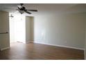 Spacious living room featuring hardwood floors and a ceiling fan at 317 Green Manor Dr # 38 B, Sun City Center, FL 33573