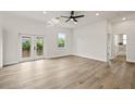 Spacious bedroom with wood-look floors and access to a patio at 457 Dawson Ne Ave, St Petersburg, FL 33703