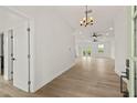 Bright and airy entryway with light wood-look floors at 457 Dawson Ne Ave, St Petersburg, FL 33703