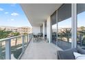 Outdoor patio with table and chairs, offering scenic views at 5120 Marina Way # 2208, Tampa, FL 33611