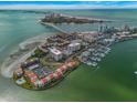 Aerial view showcasing waterfront property with marina and bridge views at 851 Bayway Blvd # 201, Clearwater, FL 33767