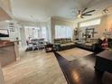 Spacious living room with hardwood floors, fireplace, and comfortable seating at 9625 Fox Hearst Rd, Tampa, FL 33647