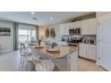 Modern kitchen with granite countertops and stainless steel appliances at 10923 Gentle Current Way, Parrish, FL 34219