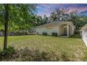 Spacious backyard with grassy lawn and privacy fence at 1210 E Mohawk Ave, Tampa, FL 33604