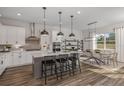 Modern kitchen with island, stainless steel appliances, and breakfast area at 12660 Glenn Creek Dr, Riverview, FL 33569