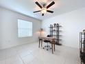 Home office with desk, shelving, and ceiling fan at 13455 Jamaica Plank Loop, Riverview, FL 33579