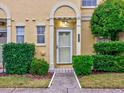 Townhome entrance with landscaping and walkway at 1505 Chateaux De Ville Ct, Clearwater, FL 33764