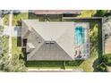 Top-down view of house showcasing roofline, pool, and backyard at 19106 Cellini Pl, Lutz, FL 33558