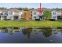 Townhome and lake view from the back of property with reflection at 1950 Marlington Way, Clearwater, FL 33763