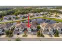 Townhome community view showcasing a lake and the property's location at 1950 Marlington Way, Clearwater, FL 33763