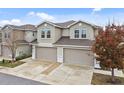 Two-story townhome with a two-car garage, situated in a community at 1950 Marlington Way, Clearwater, FL 33763