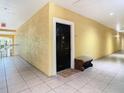 Apartment hallway with a black door and a welcome mat at 2010 E Palm Ave # 14304, Tampa, FL 33605