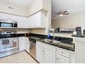 Modern kitchen with stainless steel appliances and granite countertops at 2010 E Palm Ave # 14304, Tampa, FL 33605