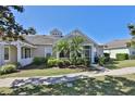 House exterior featuring a screened porch and palm trees at 217 Oceania Ct, Apollo Beach, FL 33572