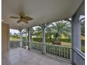 Spacious screened porch overlooking backyard with palm trees at 217 Oceania Ct, Apollo Beach, FL 33572