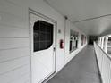 Condo hallway with white walls and doors at 2449 Columbia Dr # 55, Clearwater, FL 33763