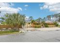 Landscaped front yard with wooden fence and gated entryway at 5780 Elton Rd, Venice, FL 34293