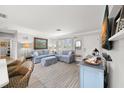 Bright and airy living room featuring a comfortable sofa at 5871 49Th N Ave, Kenneth City, FL 33709